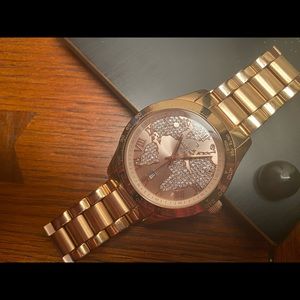 Michael Kors rose gold bracelet watch.
